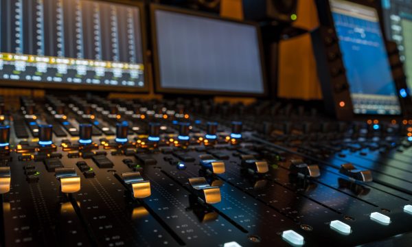 Closeup of sound mixing panel knobs and switches Closeup of sound mixing panel knobs and switches